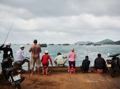 People at a harbour in Con Dao