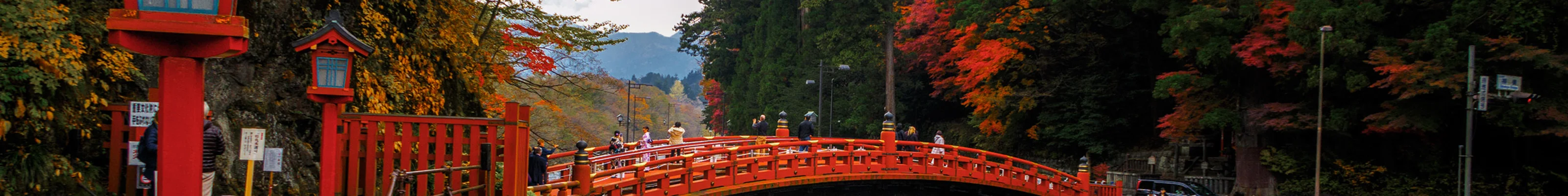Ornate red bridge over river in Nikko 