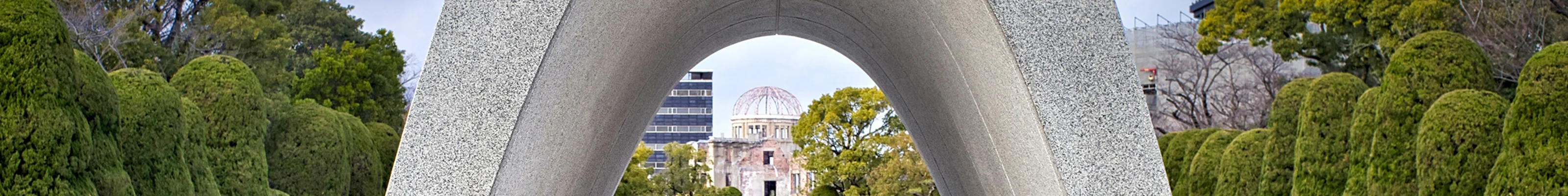 Stone arch with flowers in front at the peace memorial in Hiroshima 
