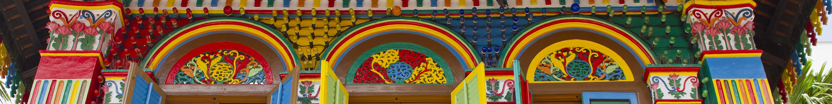 Brightly coloured Peranakan houses in Little India district of Singapore 