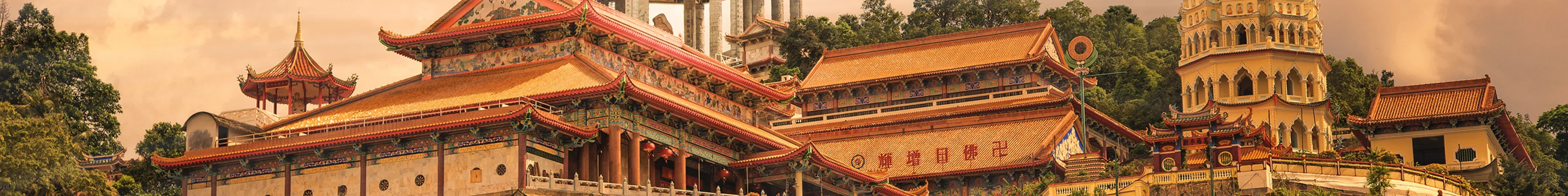 Sunset lights up traditional architecture at Kek Lok Si temple in Penang, Malaysia