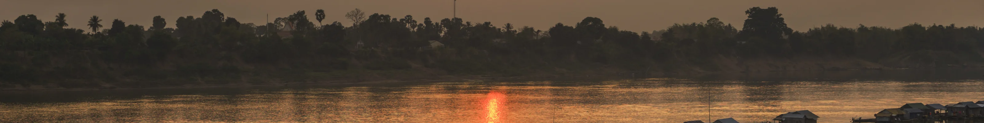 A village on stilts in Kratie as the sun sets in Cambodia