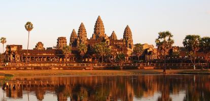 Early morning sun in Angkor Wat temple, with reflections showing on the lake