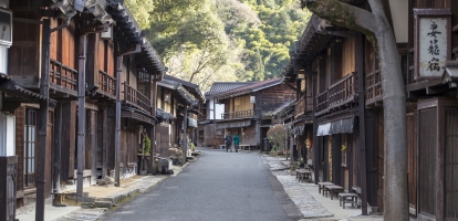 Wooden buildings lining street in Tsumago, Japan