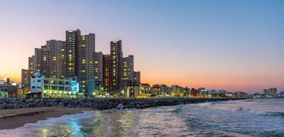 Skyline of Sokcho behind the sea at sunset