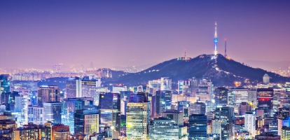 Skyline filled with bright colors from buildings in Seoul at night