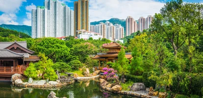 Ornate gardens with skyscrapers in the background