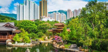 Ornate gardens with skyscrapers in the background