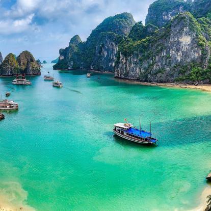 Beautiful azure waters in Ha Long Bay, Vietnam, with cruises in the bay