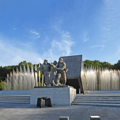 Three statues of men commemorate the democratic movement in May 18 Memorial Park in Gwangju, South Korea