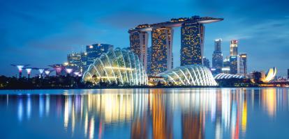 Dusk view of a different angle of Marina Bay in Singapore, with Marina Bay Sands and the Supertree Grove in view