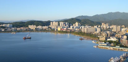 Beautiful sunset view of South Kora's Sokcho harbour, with both boats and buildings visible