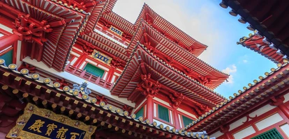 Ornate red temple in middle of Chinatown in Singapore 