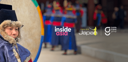 A Korean guard in traditional attire stands by a colourful drum at Deoksugung Palace in Seoul.