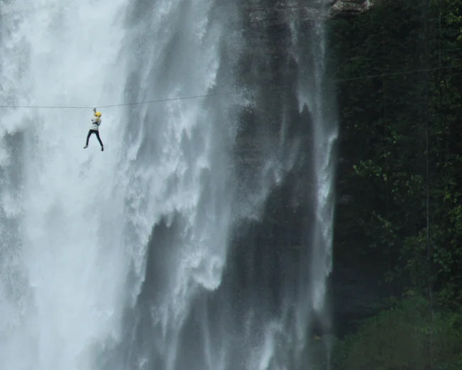 Ziplining over waterfall