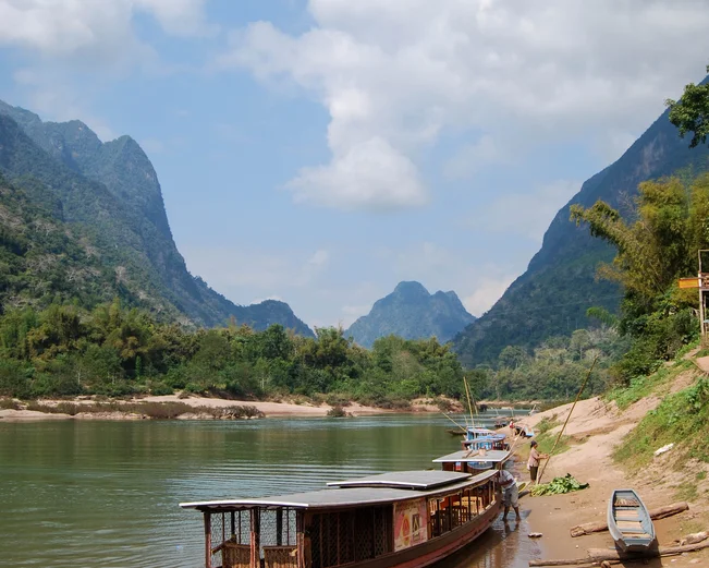Boat on river at Nong Khiaw - Tyler Palma