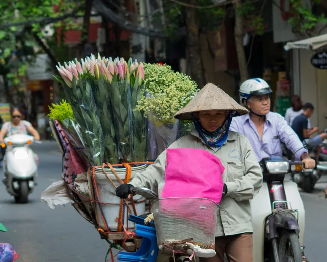 Lady with flowers in Hanoi streets