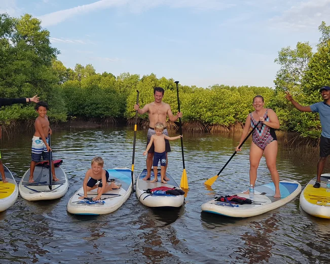 Family paddleboarding in Kampot