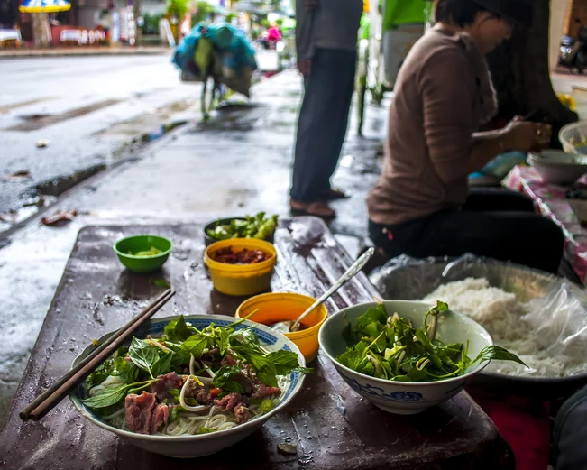 Eating Pho on the streets of Hanoi 