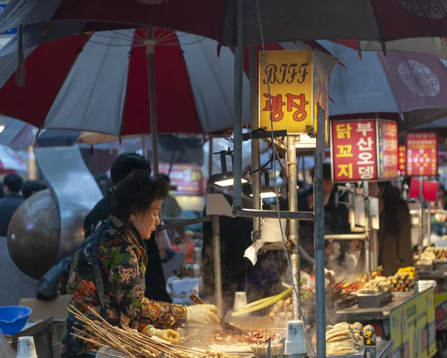 Woman at food stall in Busan 