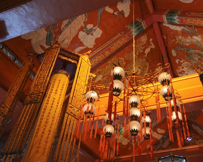 Lanterns inside red room in monastery 
