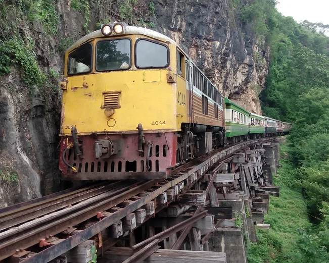 Train on tracks along cliffside 