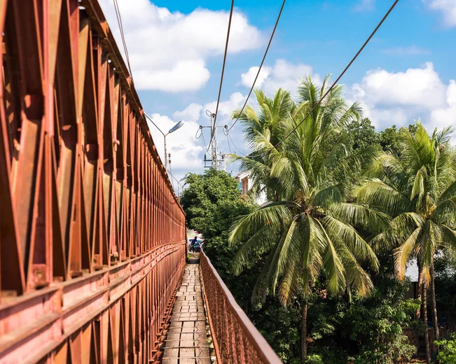 Railway bridge and pedestrian walkway over Mekong river 