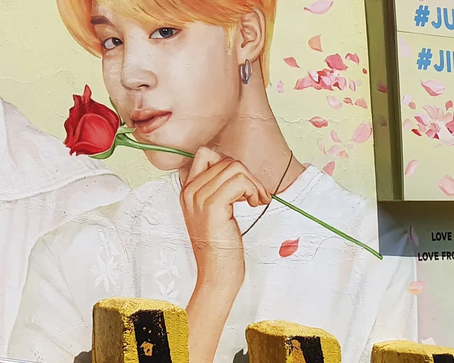 Street art portrait of a Korean idol in the streets of Busan