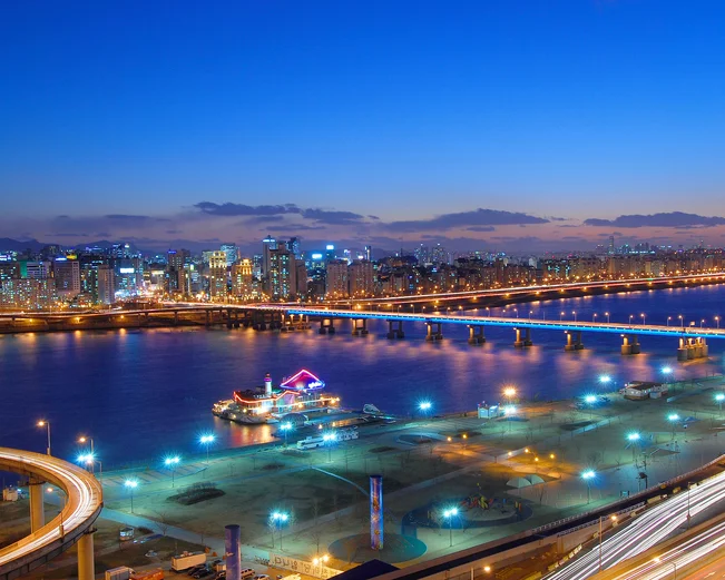 Calm waters under Yeongdong Bridge near Gangnam at night in Seoul, South Korea