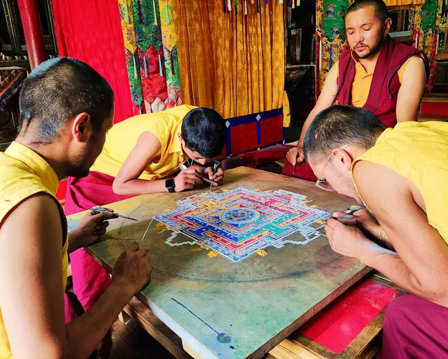Tibetan monks doing traditional art