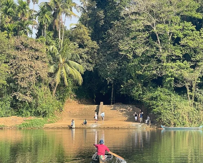Man on canoe in India