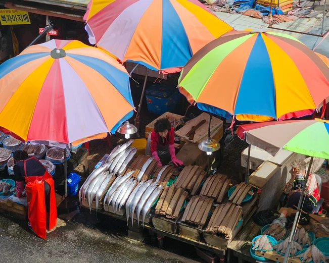 View of colourful umbrellas over Busan fish market in South Korea