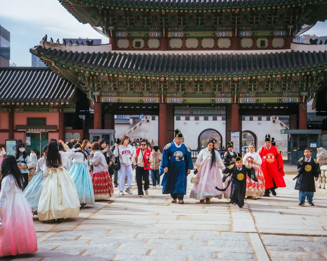 Seoul palace in November with people wearing traditional hanbok 