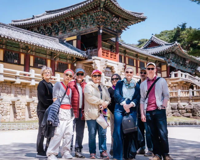 Visitors standing in front of a traditional Korean temple in Gyeongju