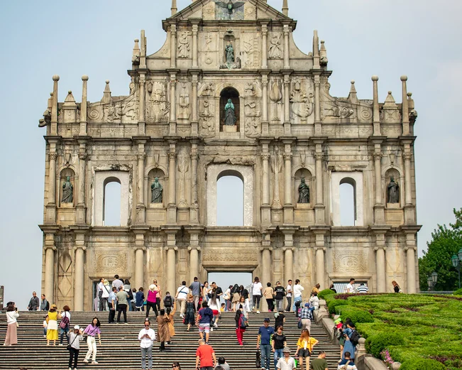 Monument in Macau in Hong Kong steps with tourists
