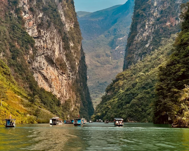 Boats passing through a river gorge