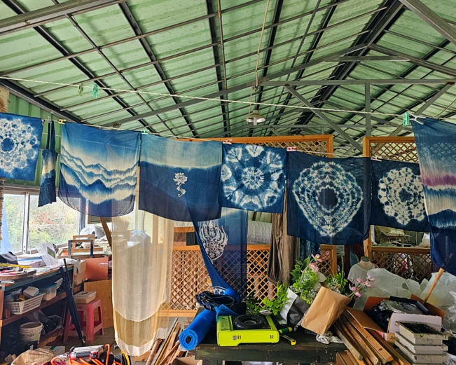 Indigo Dyeing workshop with examples of patterned cloth
