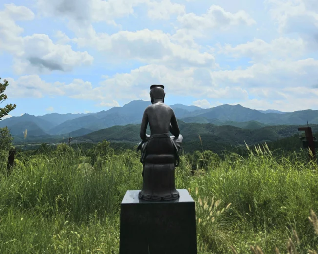 View of Sayuwon gardens and a statue