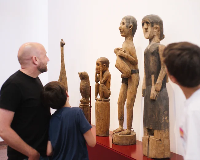 Family looking at statues in Museum of Ethnology