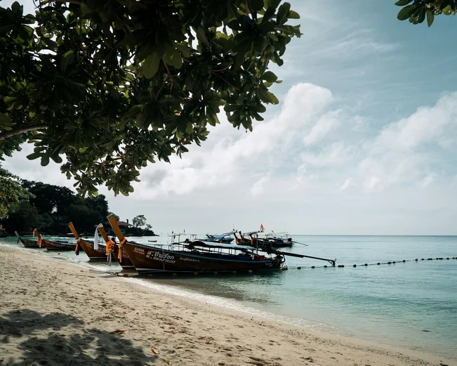 Krabi beachfront with longtail boats