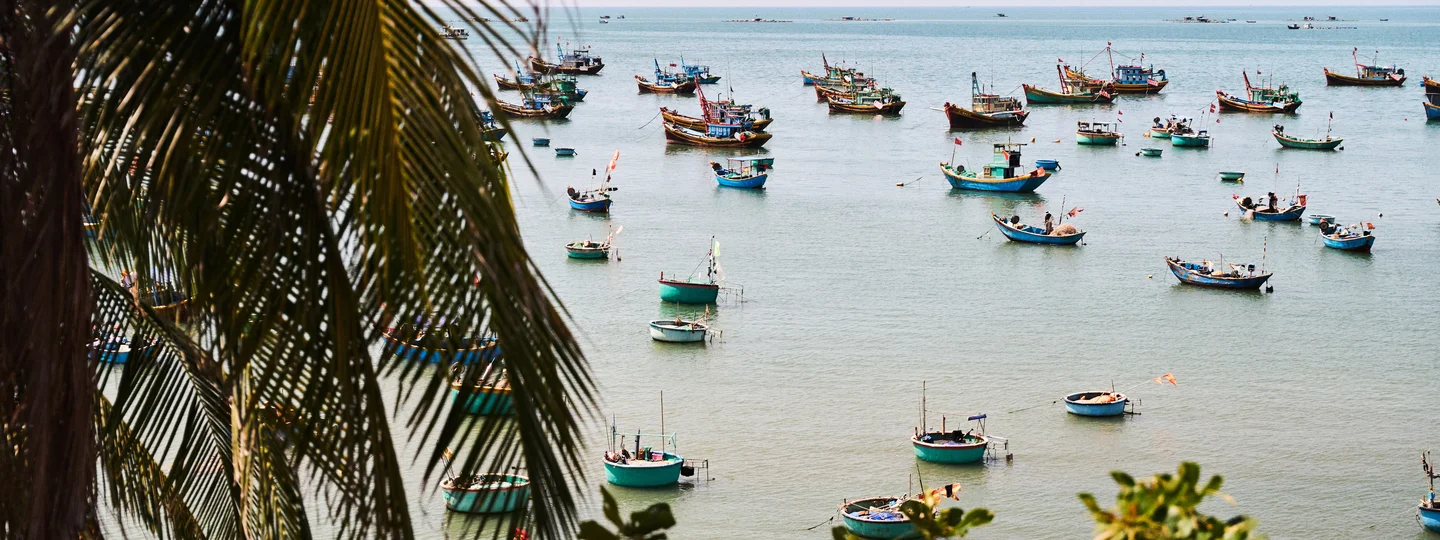 Coconut boats in the sea in Vietnam