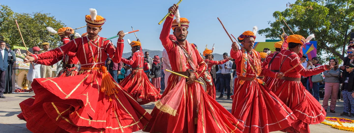 Men in traditional red outfits at the Kite Festival in Jaipur
