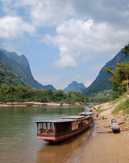 Boat on river at Nong Khiaw - Tyler Palma