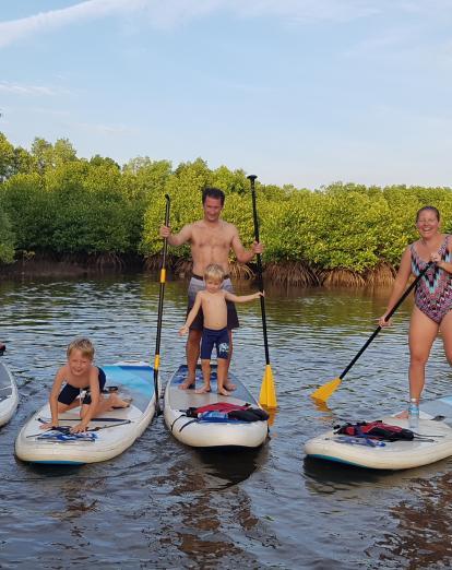 Family paddleboarding in Kampot