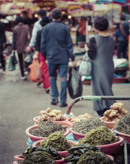 Dried fish in bowls at busy Jagalchi Fish Market in Busan