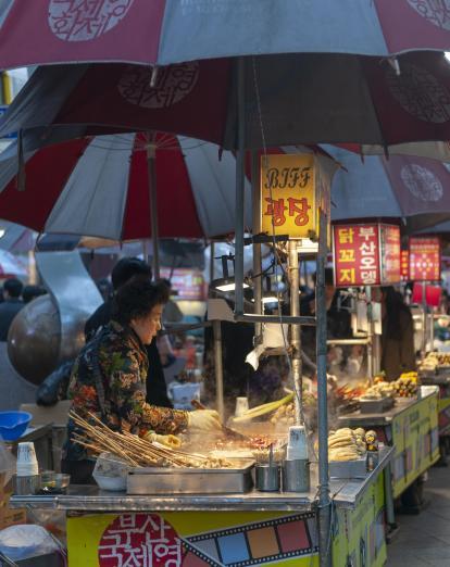 Woman at food stall in Busan 