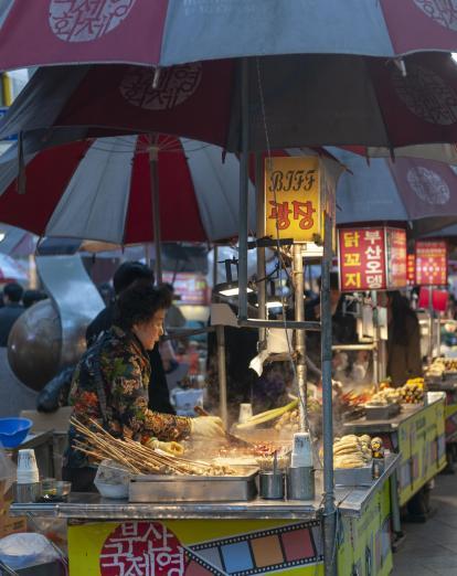 Woman at food stall in Busan