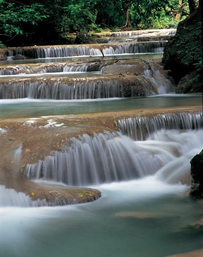 Gently cascading waterfall in Kanchanaburi, Thailand