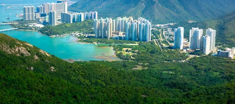 View down to skyscrapers and beaches from top of mountain