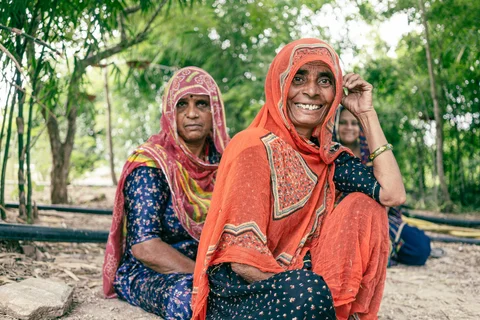 Indian women smiling at the camera